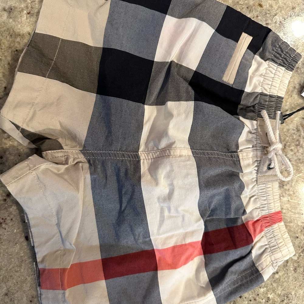 Baby Burberry swim trunks -9 mos brand new w tags !